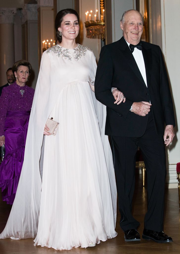 King Harald escorting Kate Middleton to dinner