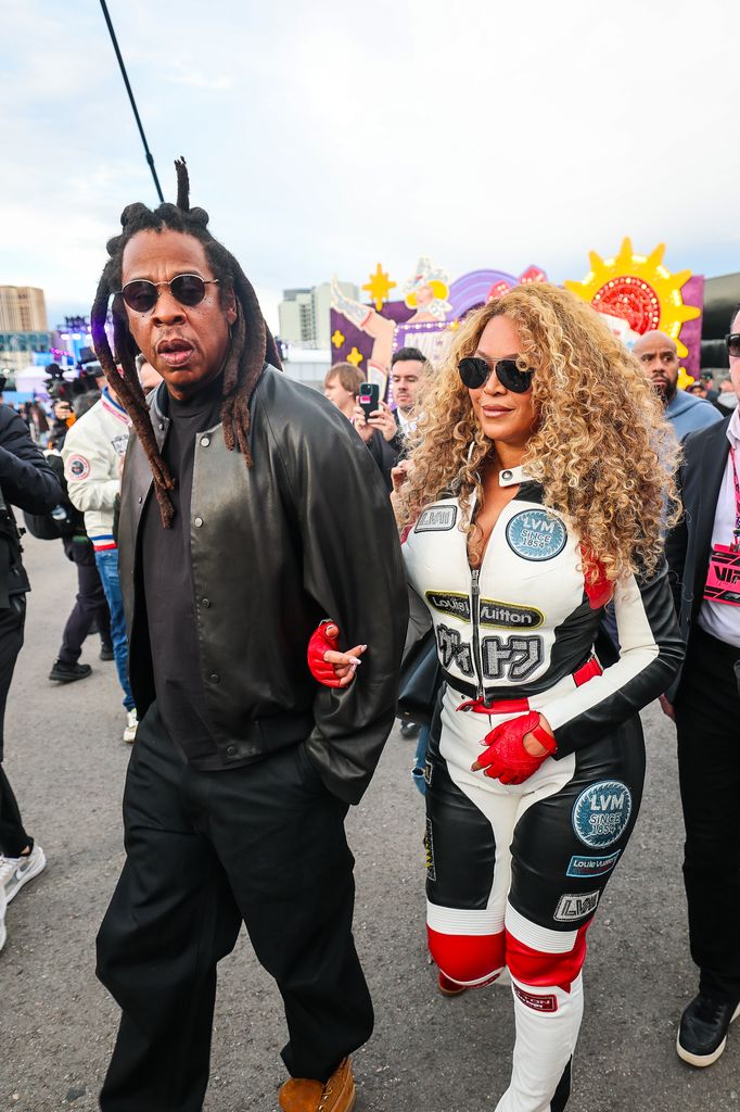 Jay-Z and Beyonce walk in the paddock during the F1 Grand Prix of Las Vegas at Las Vegas Strip Circuit 