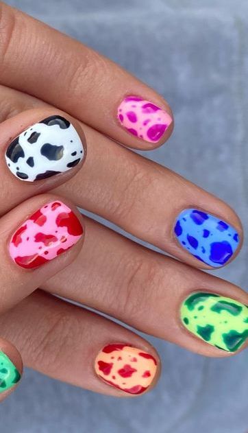 multicolored western nails with rainbow cow print