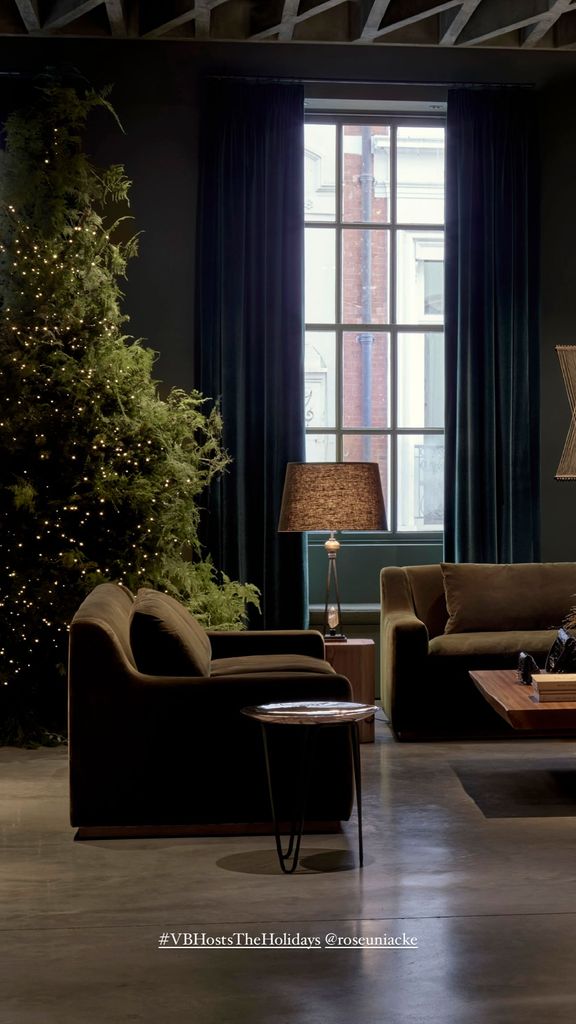 Inside Victoria Beckham's London store showing velvet chair and sparkling Christmas tree