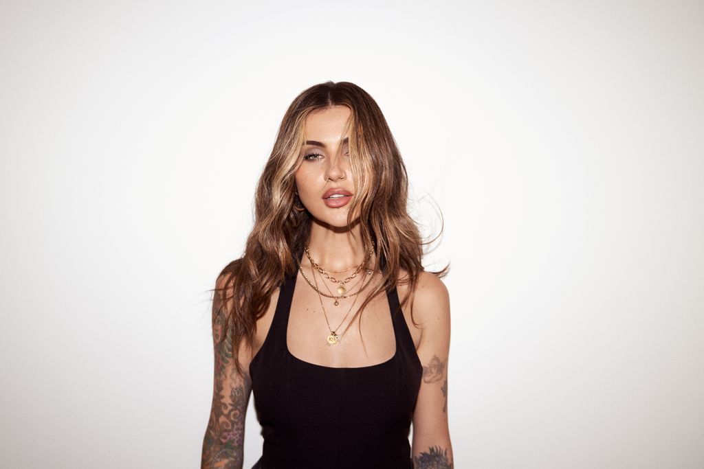 young woman in a black vest top