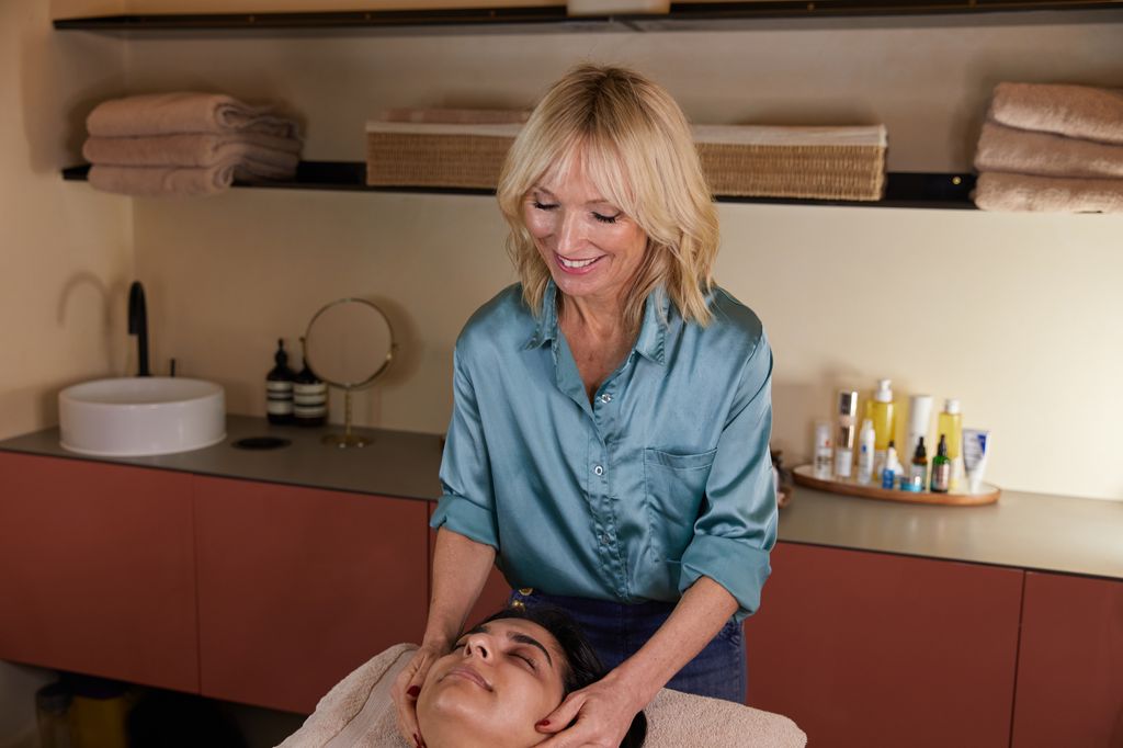 Blonde woman performs acupuncture 