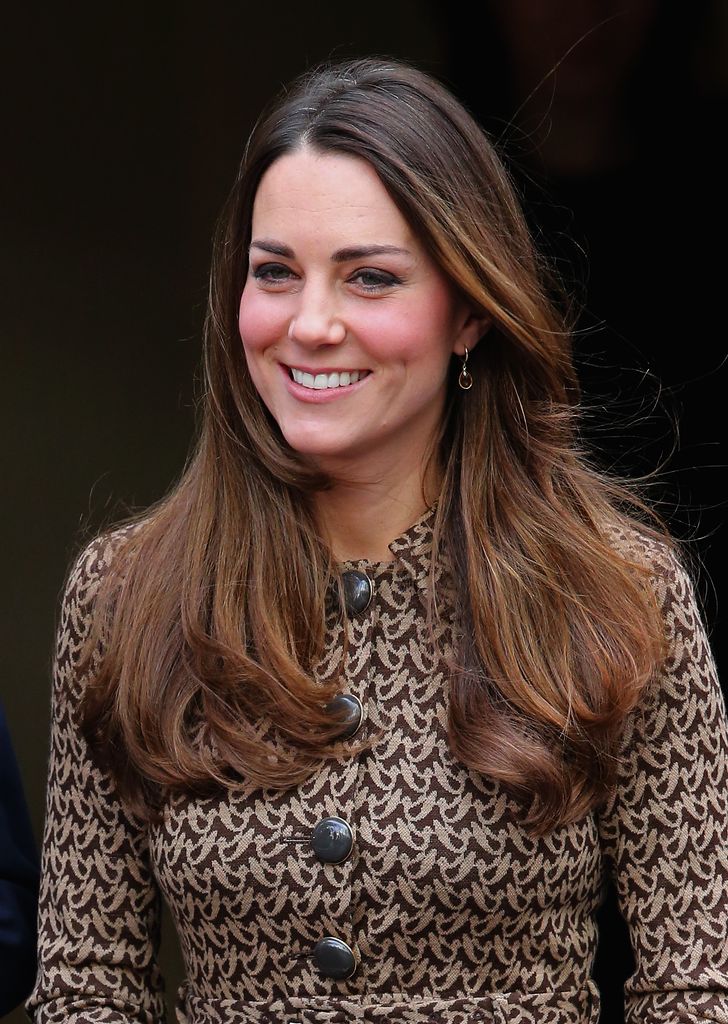 kate middleton wearing coat dress and smiling 