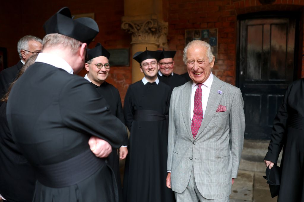 King Charles laughs with Fathers during a tour of The Oratory of St. Philip Neri 