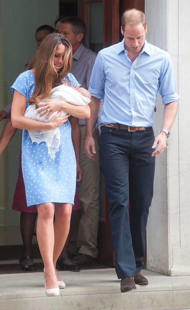 Kate Middleton carrying a baby Prince George and walking with Prince William