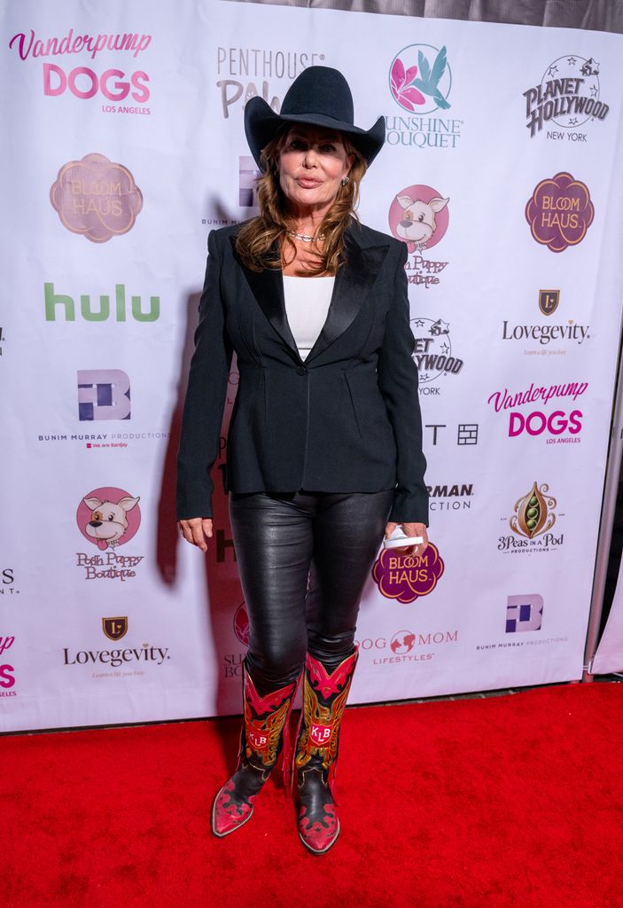 photo of kelly lebrock in cowboy hat and boots