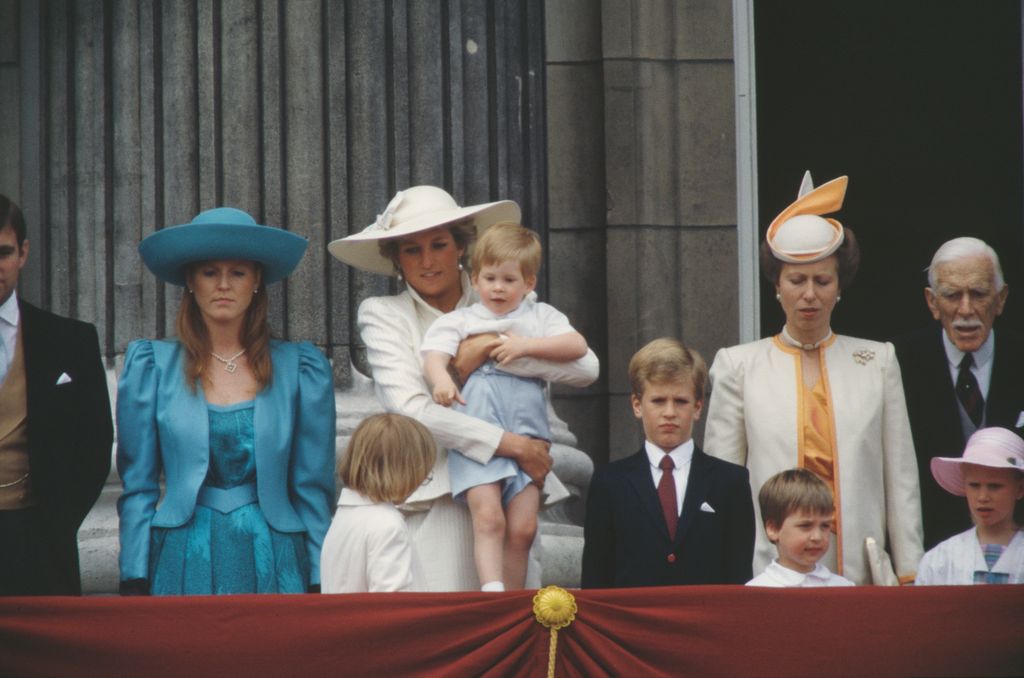 Sarah Duchess of York, Diana, Princess of Wales (1961 - 1997), Prince Harry and Princess Anne watch the Trooping the Colour ceremony from the balcony of Buckingham Palace in London, June 1987. Diana is wearing a suit by Jan Van Velden and a Philip Somerville hat. (Photo by Jayne Fincher/Princess Diana Archive/Getty Images)