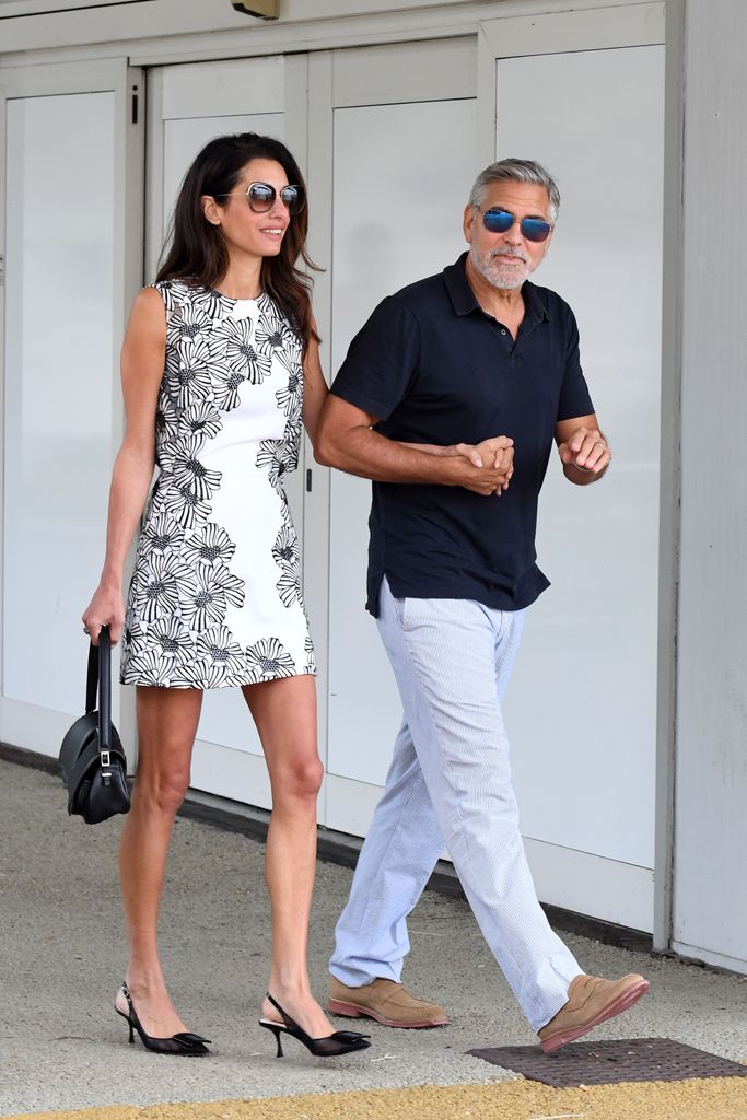 Amal Clooney in a mini dress with George Clooney