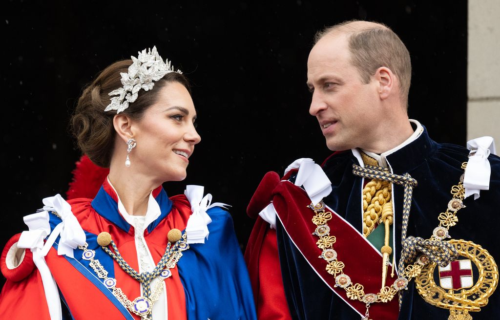 William and Kate in ceremonial clothes looking at eachother