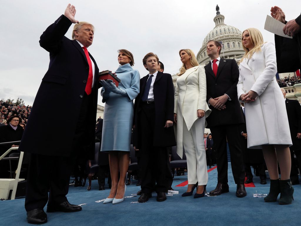 U.S. President Donald Trump takes the oath of office as his wife Melania holds the bible and his children Barron, Ivanka, Eric and Tiffany watch as U.S. Supreme Court Chief Justice John Roberts (R) administers the oath during inauguration ceremonies swearing in Trump as the 45th president of the United States on the West front of the U.S. Capitol in Washington, DC. January 20, 2017