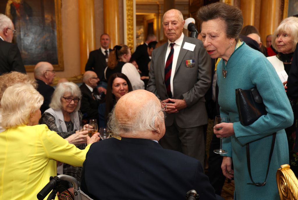 Princess Anne speaks to war veterans during a reception for Korean war veterans
