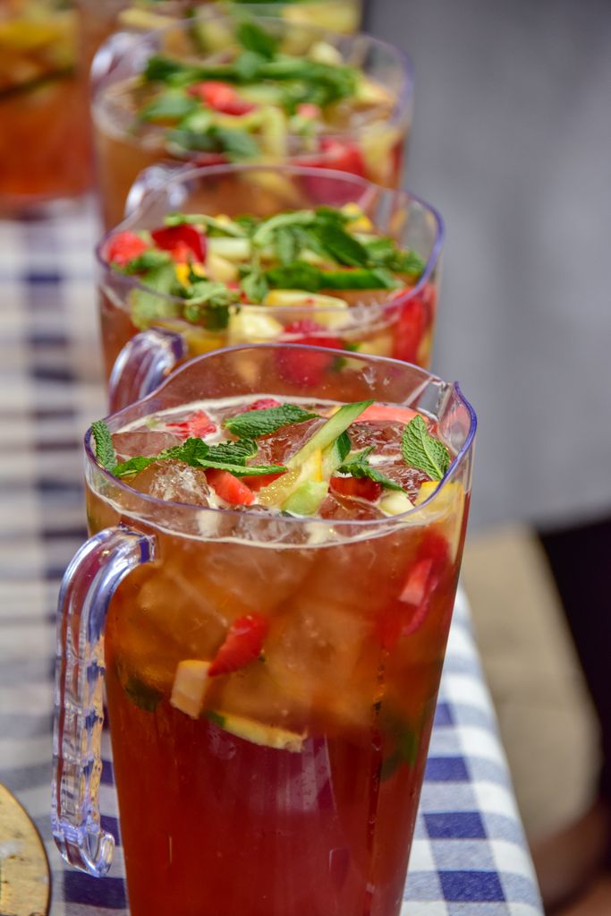 Jugs of Pimm's on a table with checked table cloth