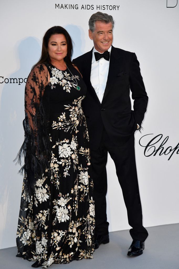 Pierce Brosnan in tuxedo and his wife Keely Shaye Smith in floral dress at the amfAR 25th Annual Cinema Against AIDS gala at the Hotel du Cap-Eden-Roc in Cap d'Antibes