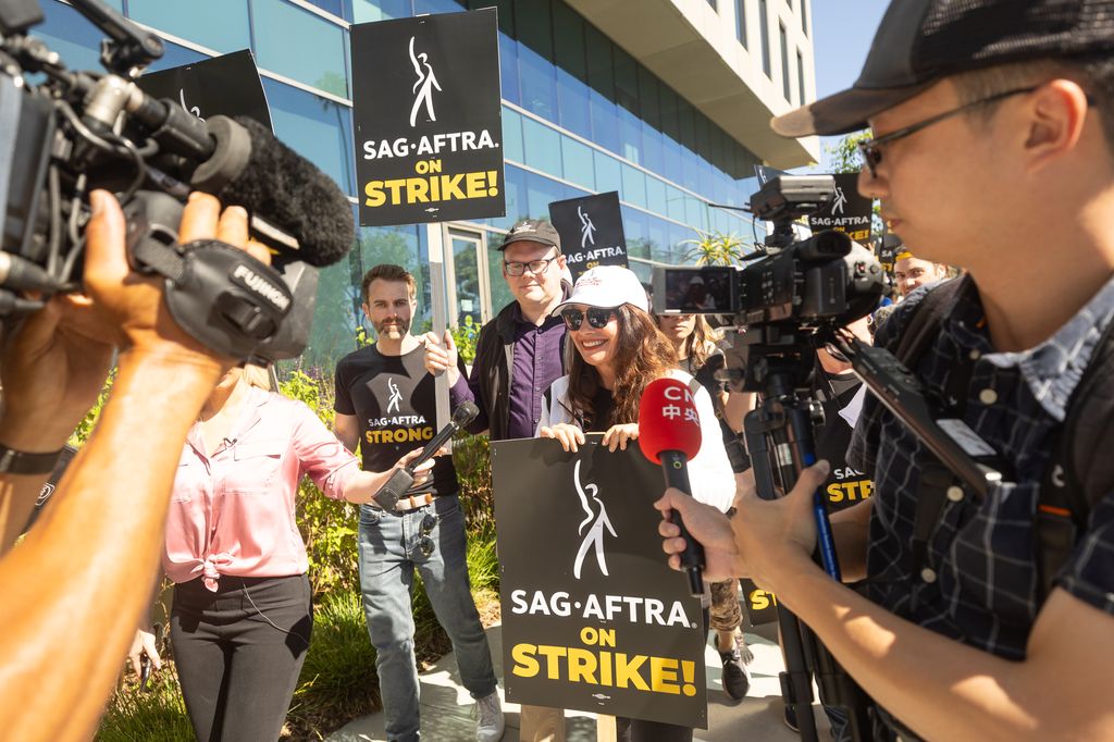 SAG-AFTRA President Fran Drescher speaks with members of the media while joining SAG-AFTRA and WGA members as they picket on Day 2
outside Netflix studios on July 14, 2023 in Los Angeles, California. Members of SAG-AFTRA, Hollywood's largest union which r