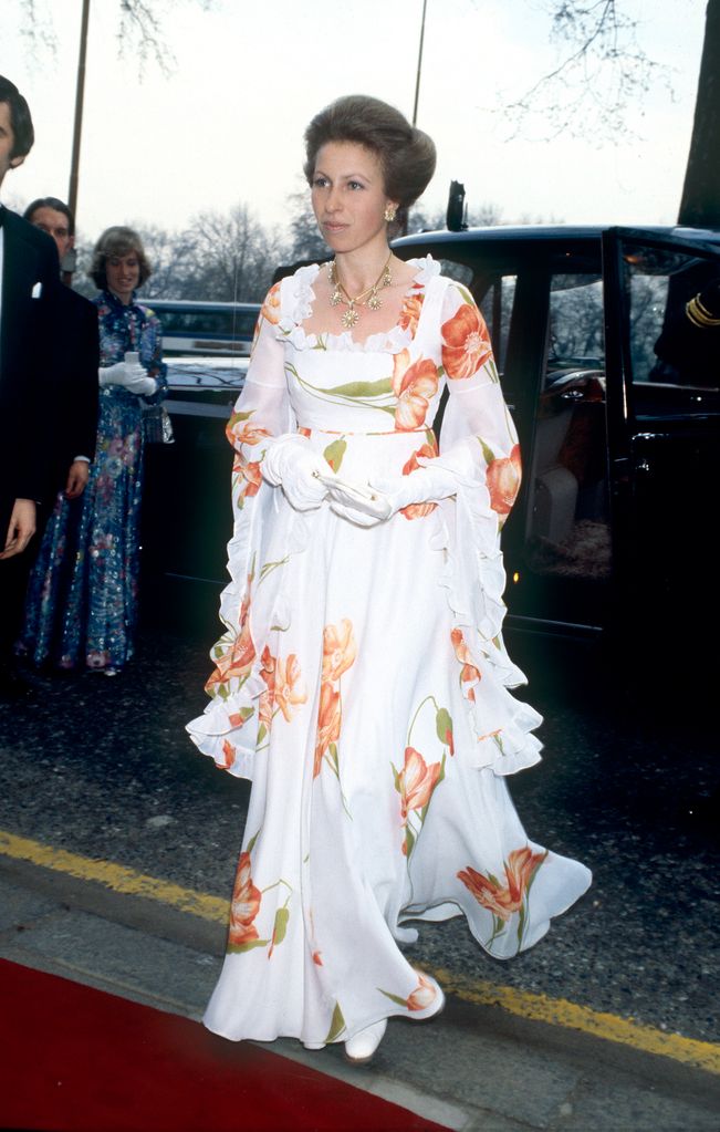 Princess Anne wears a full length evening gown to attend a night at the theatre in the 1980s