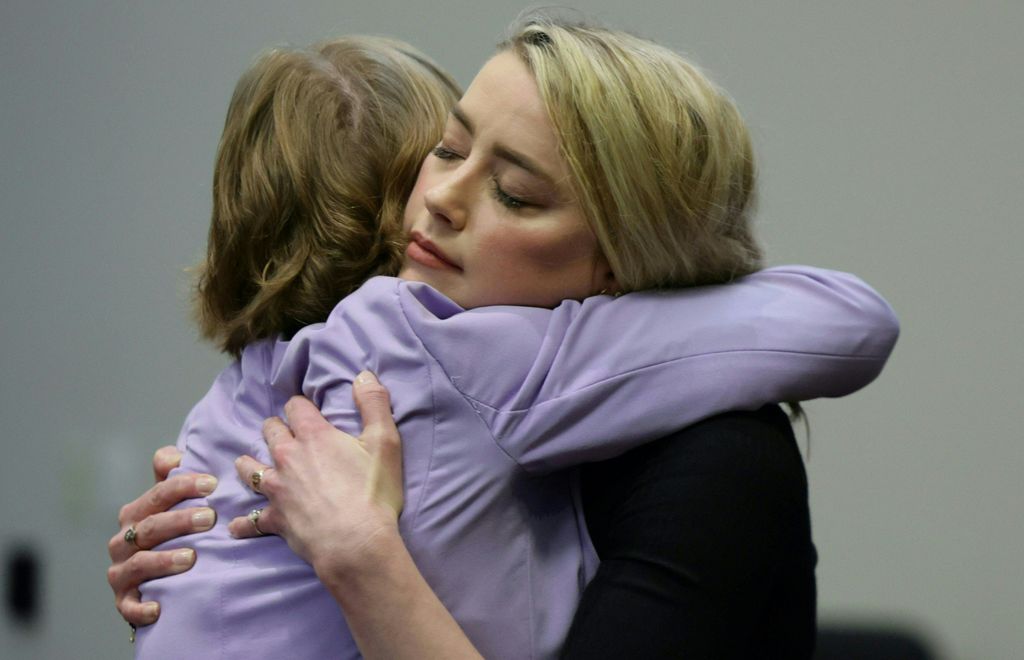 Amber Heard hugs her lawyer Elaine Bredehoft after the jury said that they believe she defamed ex-husband Johnny Depp while announcing split verdicts in favor of both her ex-husband Johnny Depp and Heard on their claim and counter-claim in the Depp v. Hea