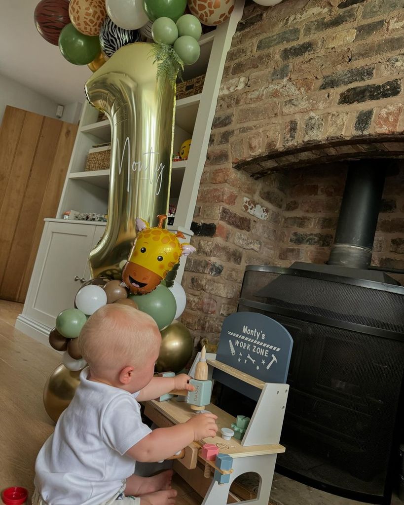 Lucy's baby son Monty was captured playing with his epic birthday 'workspace'