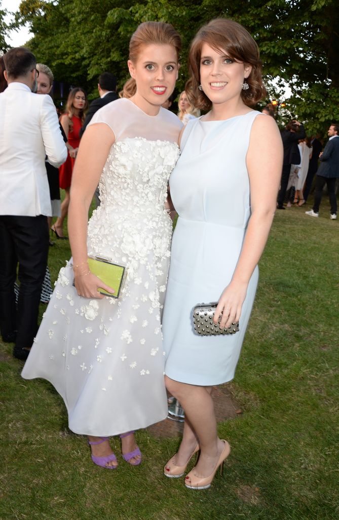 Princess Beatrice in white alongside her sister Princess Eugenie 