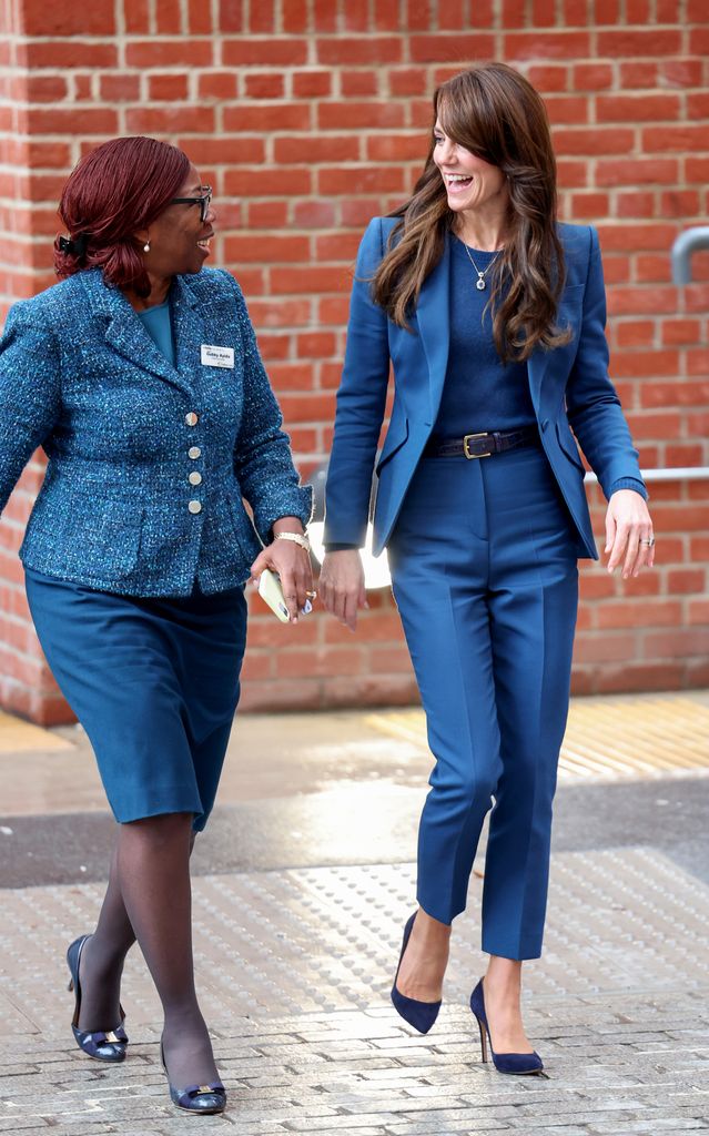 two women wearing teal outfits