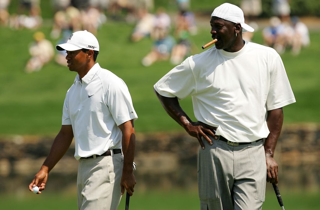 Tiger Woods and Michael Jordan walk around on the 17th green during the Pro-am at the Wachovia Championship at Quail Hollow Country Club on May 2, 2007