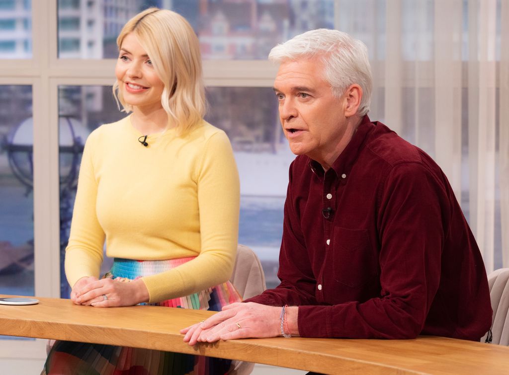 Phillip Schofield Holly Willoughby sit side by side to present This Morning