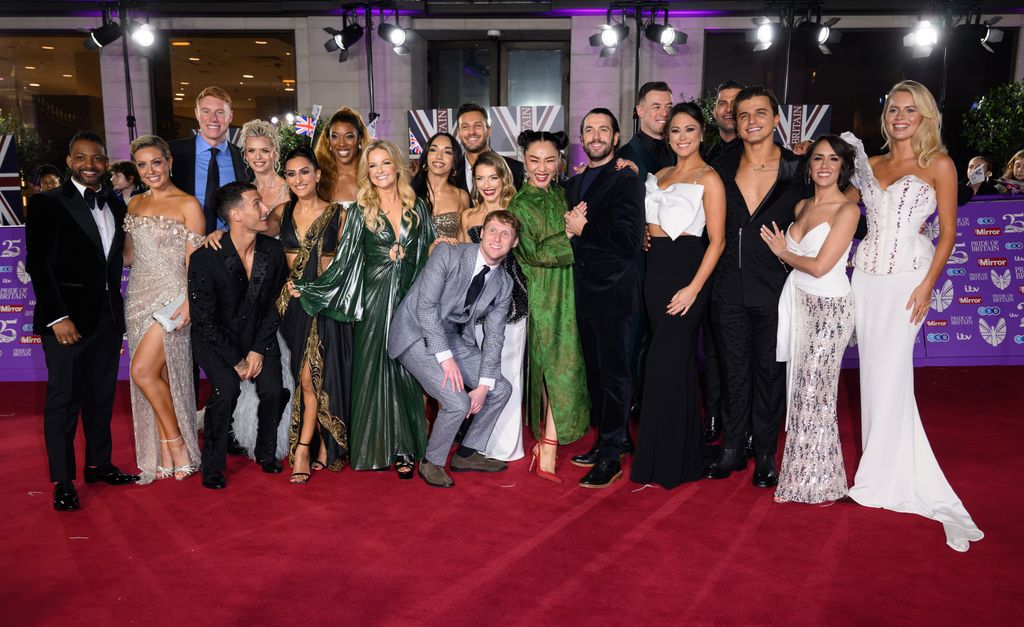 A group of professional dancers and celebrities from Strictly Come Dancing posing together