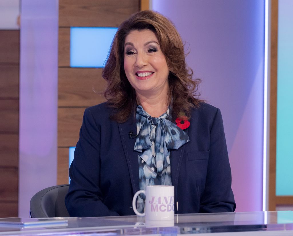 Jane McDonald in blue outfit