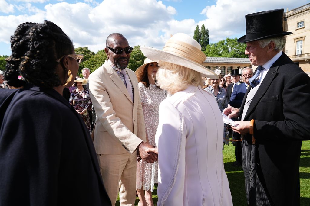 Queen Camilla greets Sir Lenny Henry 