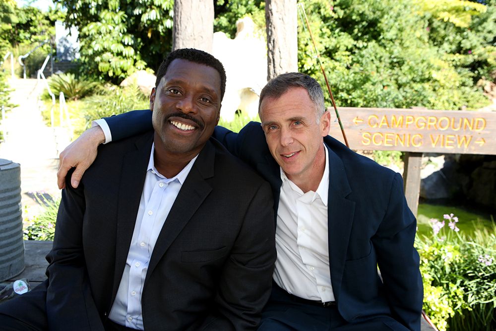 David Eigenberg with his arm around Eamonn Walker