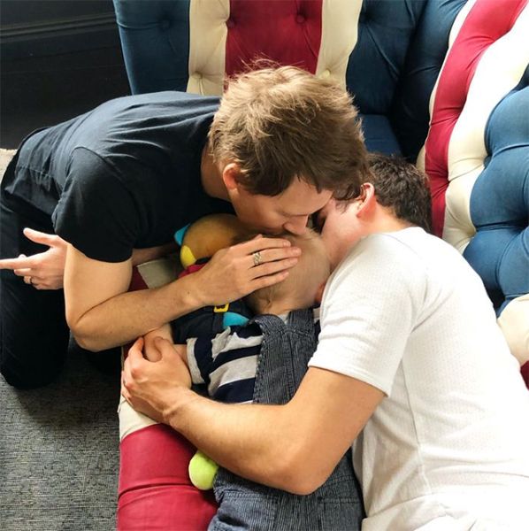Dustin Lance Black and Tom Daley kissing son