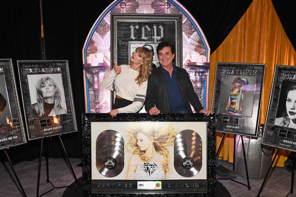 Taylor Swift and  CEO of Big Machine Records Scott Borchetta plaque presentation backstage at the Taylor Swift reputation Stadium Tour at MetLife Stadium on July 21, 2018 in East Rutherford, New Jersey