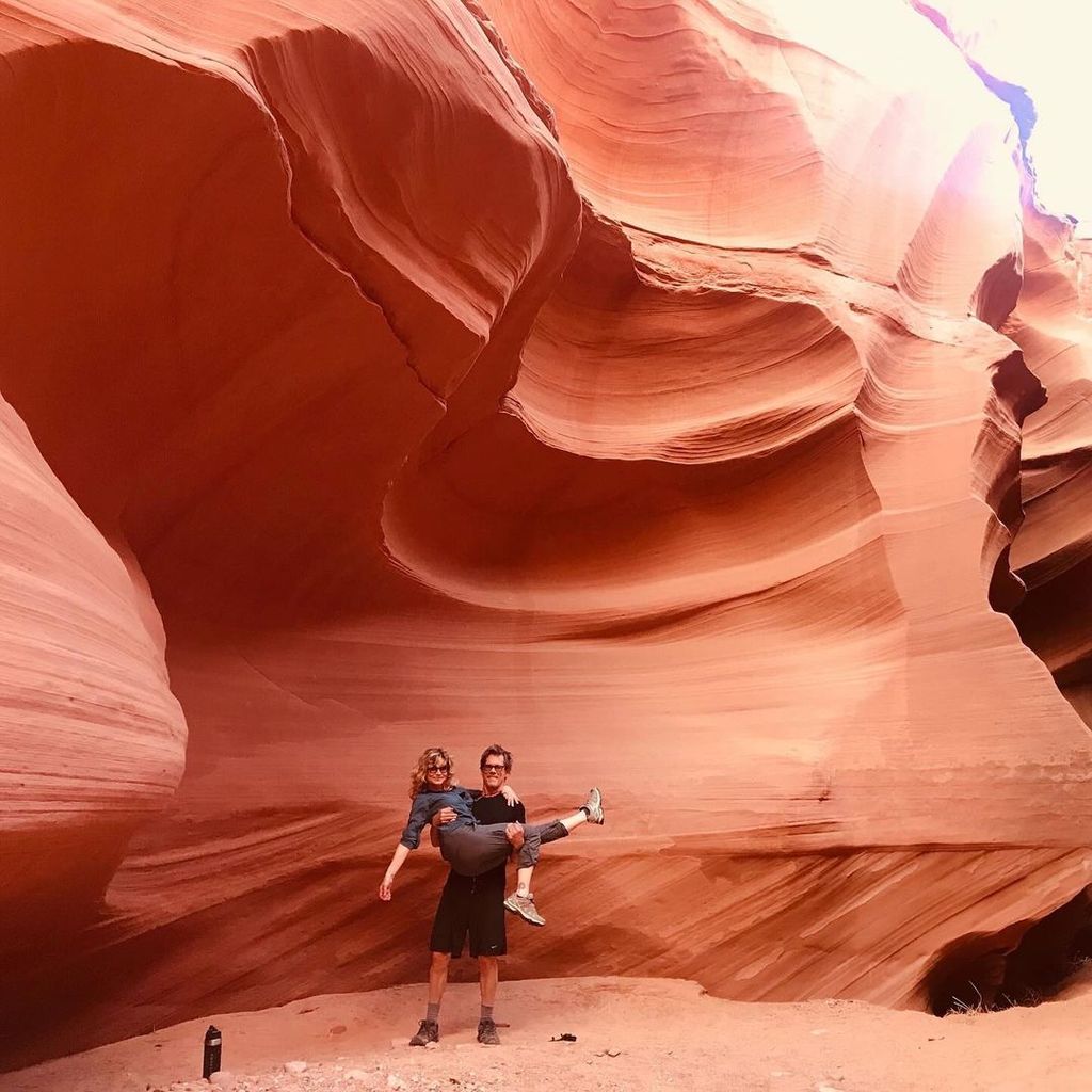 Kevin Bacon poses with wife Kyra Sedgwick in his arms in front of a canyon formation in Sedona, Arizona, shared on Instagram