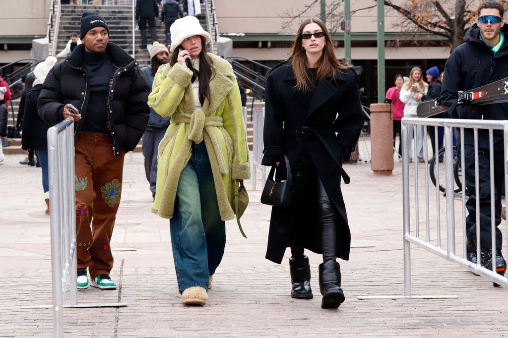  Hailey Bieber is seen out for a walk with friends on December 31, 2022 in Aspen, Colorado in a green fluffy coat