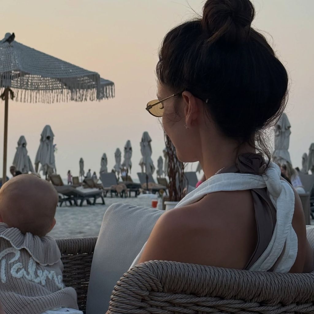 Michelle keegan holding daughter on beach