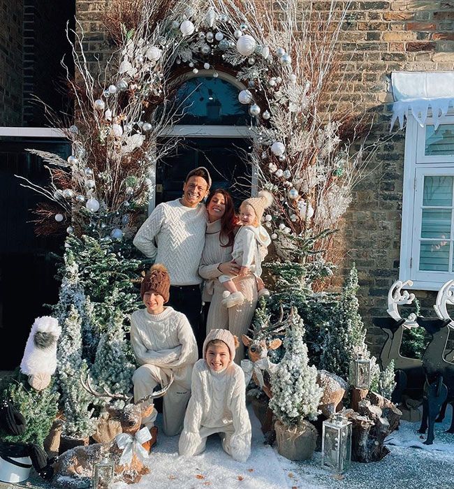 Stacey solomon and family outside festive door