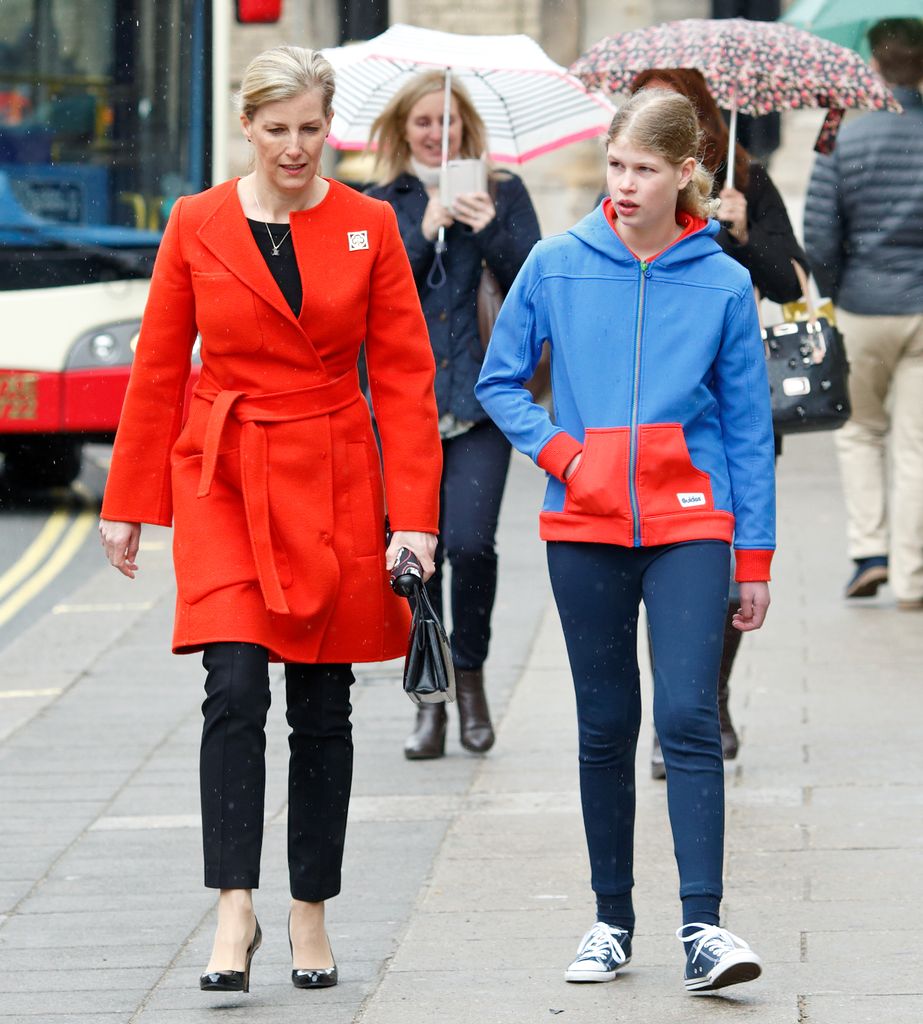 Sophie Wessex in red coat walking with Lady Louise Windsor