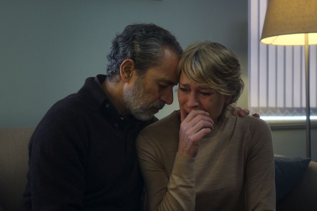 man hugging crying woman