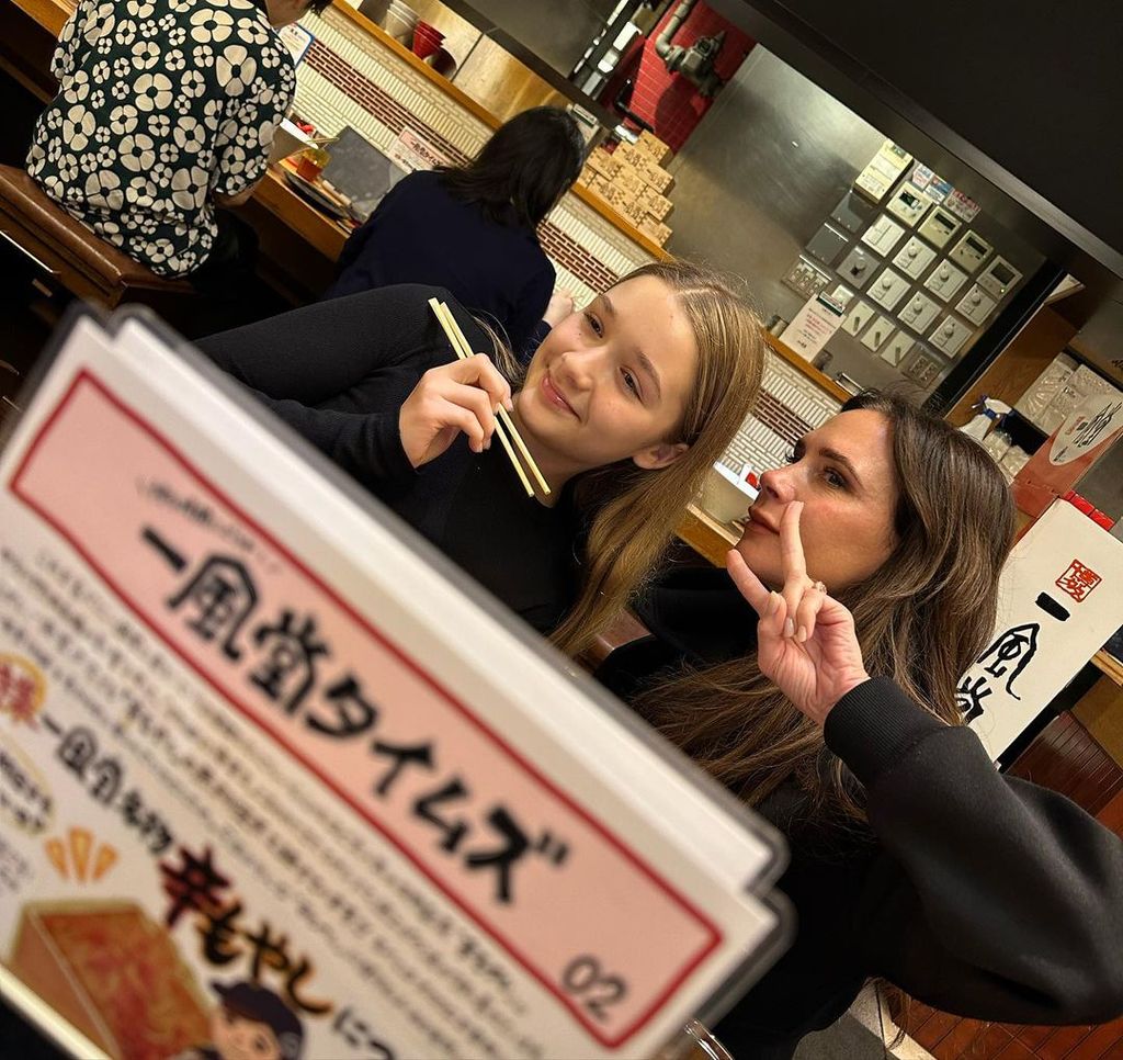 Victoria and Harper matched in black jumpers for a casual supper