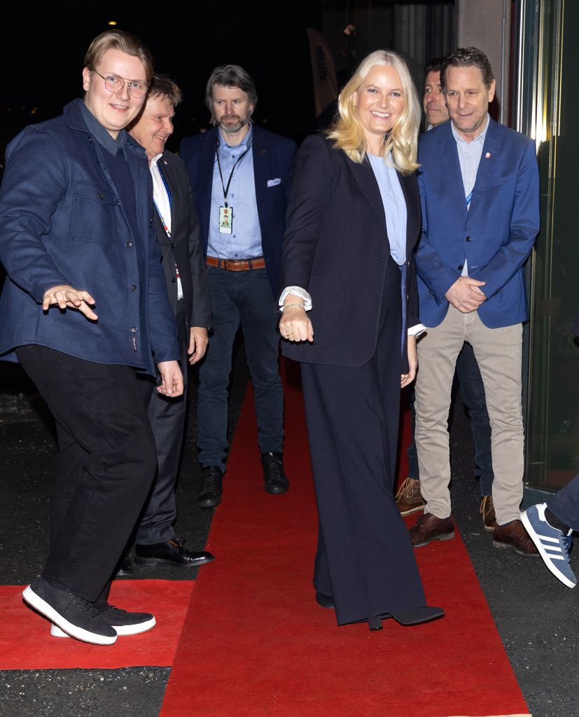 Crown Princess Mette-Marit and Prince Sverre Magnus smile as they arrive at handball tournament