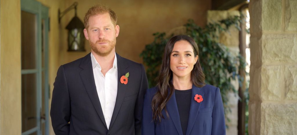 prince Harry standing with Meghan Markle