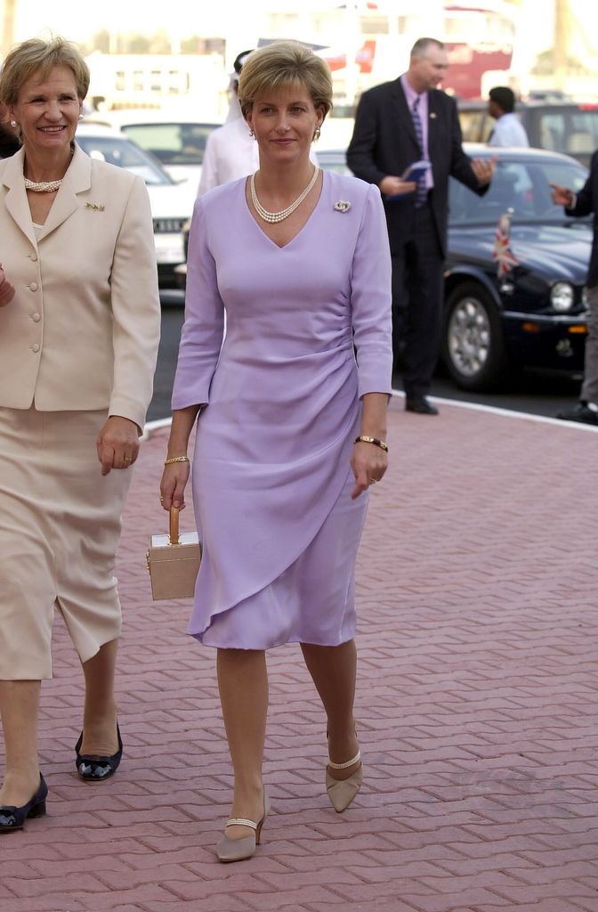 Sophie walking in lilac dress 