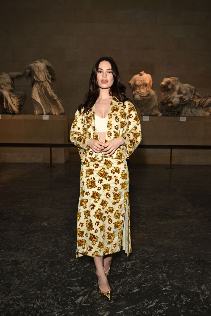Lily James opted for a stunning yellow floral co-ord, paired with a bustier to attend the Erdem show.