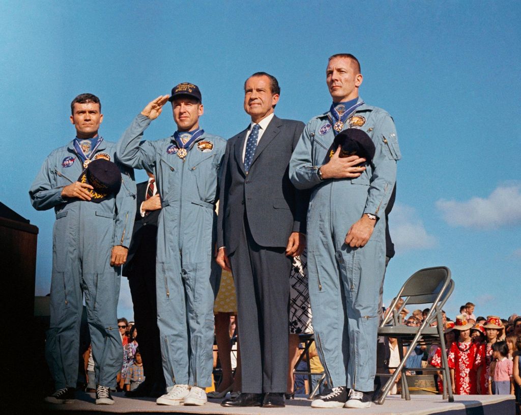 President Nixon presents astronauts James A. Lovell Jr (2L) commander; John L. Swigert Jr (R); and Fred W. Haise Jr (L) with the Presidential Medal of Freedom in April 1970