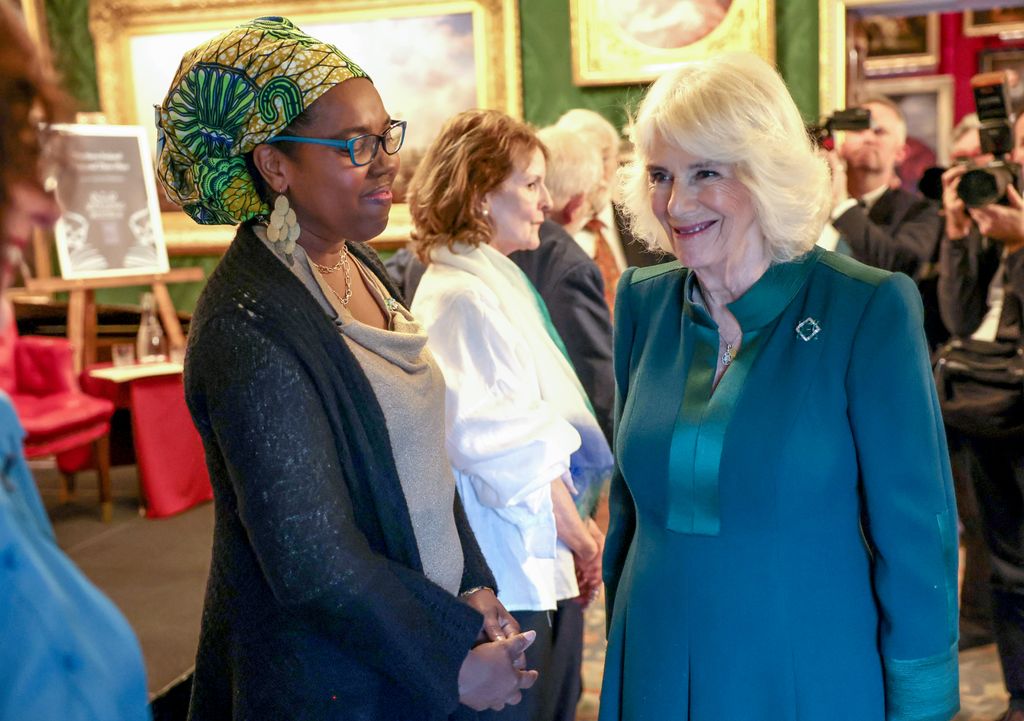 Queen Camilla speaks with poet Raquel McKee as she attends Northern Ireland: Poets and Their Place