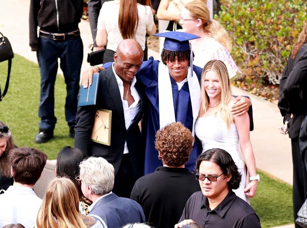 Seal attends son Henry's High School Graduation in Pacific Palisades. Seal brought his long time girlfriend Laura Strayer to the heart-warming family event!
