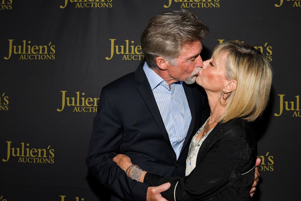 Olivia Newton-John and John Easterling attend the VIP reception for upcoming "Property of Olivia Newton-John Auction Event at Julien's Auctions on October 29, 2019 in Beverly Hills, California