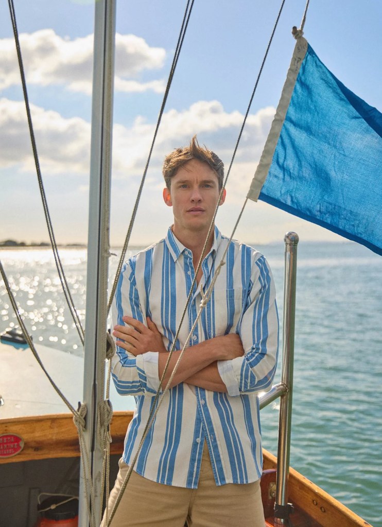 A man in a stripe shirt on a boat
