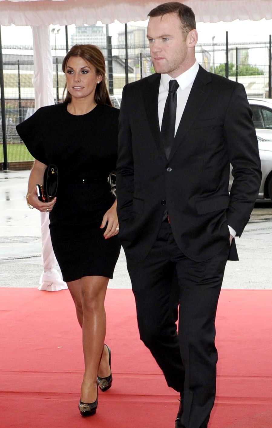 Wayne Rooney and Coleen Rooney in matching black outfits