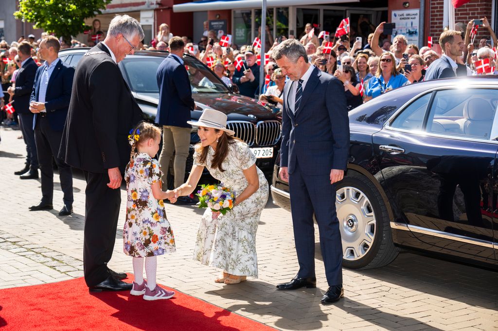 GRASTEN, DENMARK - JULY 9: King Frederik X of Denmark and Queen Mary of Denmark are welcomed by the mayor Erik Lauritzen and the public as they arrive in Graasten, before they walk through the town to their Summer residence at Grasten Castle on July 9, 2024 in Grasten, Denmark. (Photo by Martin Sylvest Andersen/Getty Images)