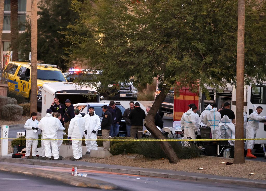 First responders, some wearing Hazmat gear, gather outside the Fashion Show mall across from the Trump International Hotel & Tower Las Vegas 